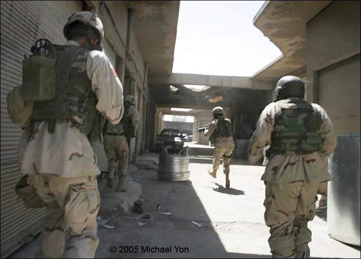 LTC Erik Kurilla (front right), the moment the bullets strike.(2nd LT front-left; radioman near-left; “AH” the interpreter is near-right.)