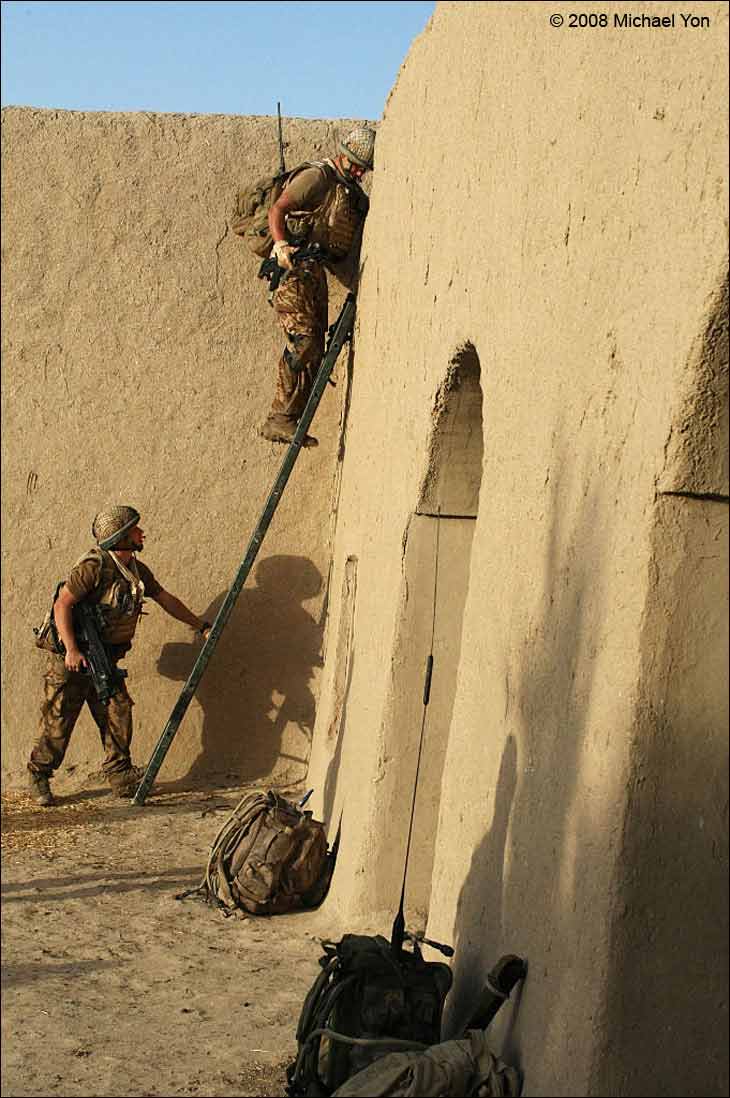 The soldiers often haul ladders.