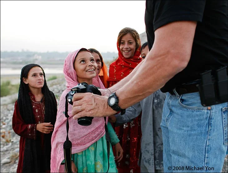The girls, with their smiling faces, were waiting back at the village.  They wanted their photos taken, too.