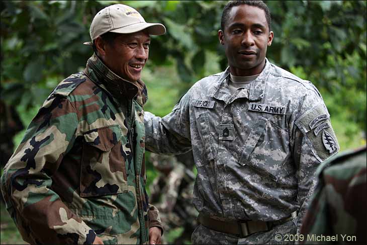 Muslim Guerrilla commander Benjie Lucsadato with American soldier.