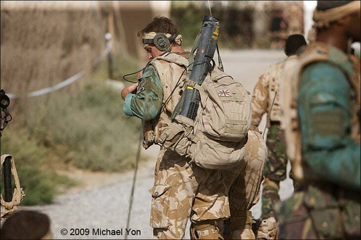 The soldiers carry rockets of various sorts.