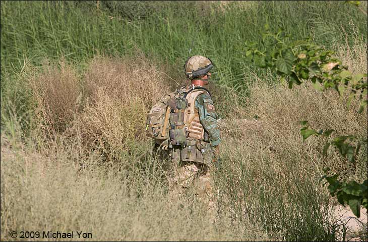 Into the Green Zone.  Unfortunately, I was unable to go on this mission as I am assigned to another platoon, so this photograph was made from base.   This soldier is fully into the battlefield.