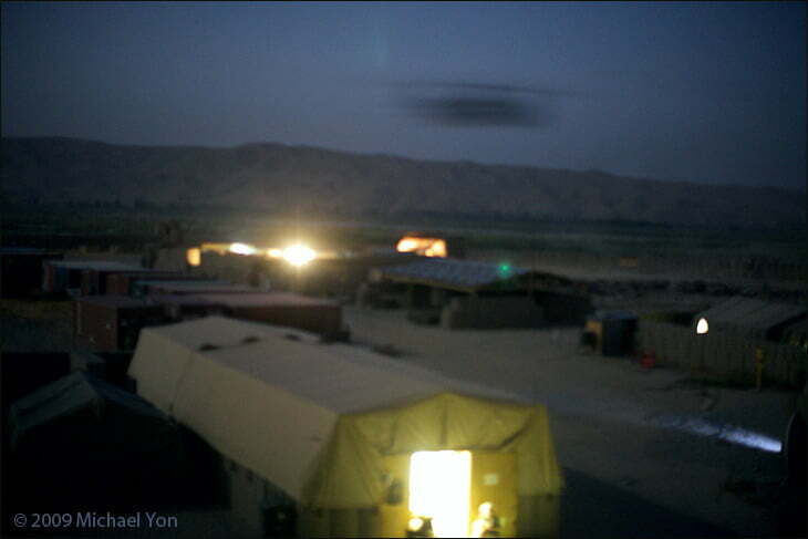 A helicopter roars into FOB Jackson in Sangin, Afghanistan. Medical tents are just next to the Helicopter Landing Site (HLS) so casualties can be quickly loaded.