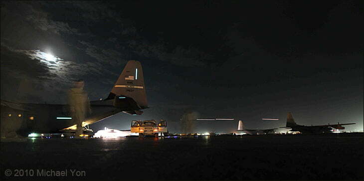 After we land, in the background, three helicopters launch on a mission at about midnight.