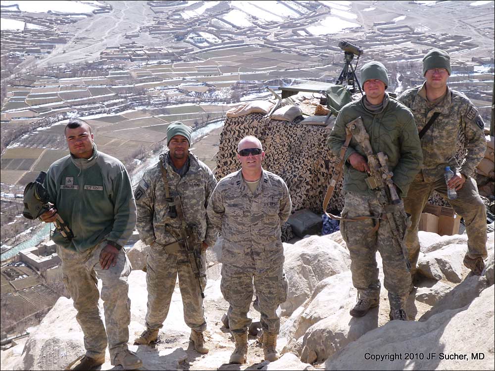 CPT Zielinski (3rd from left) visits with sniper team at an observation post somewhere above 10,000 feet *